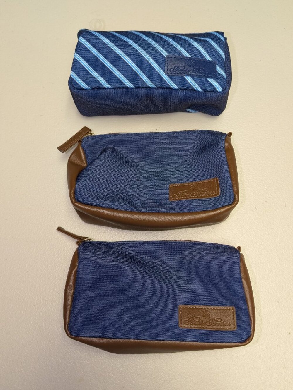 Set of three Brooks Brothers first class amenity kits